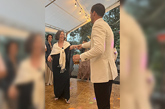 Ellen Keir dances with son at wedding