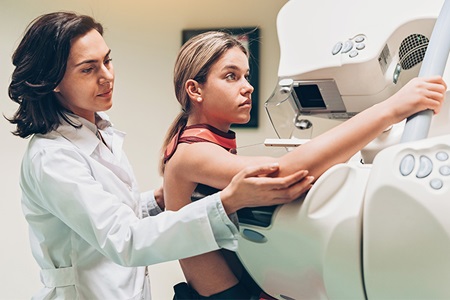 Doctor and patient making a mammography