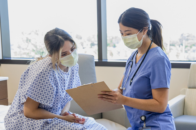 Patient consulting with nurse during emergency room visit