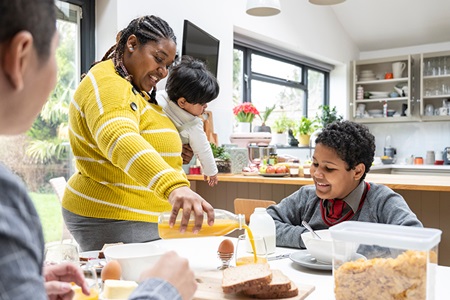 A family eats breakfast together.