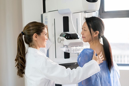 A woman undergoes a mammography.