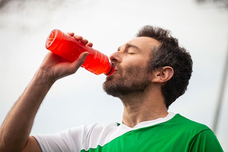 Man drinking water during workout