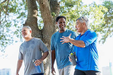 A group of friends exercises outside together.